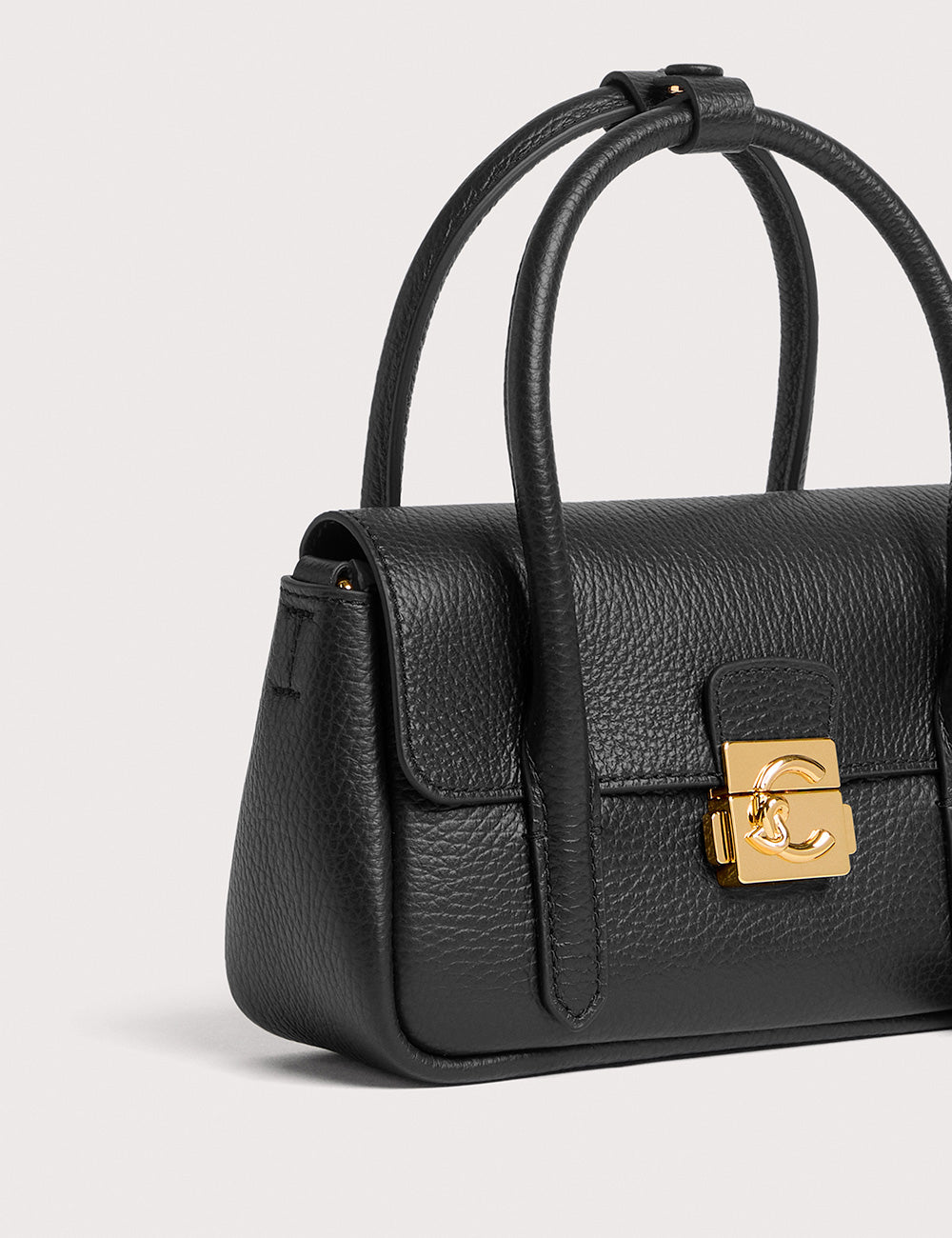 Borsa in pelle nera ciottolata Coccinelle C-Me Lock Noir con chiusura logo CC oro