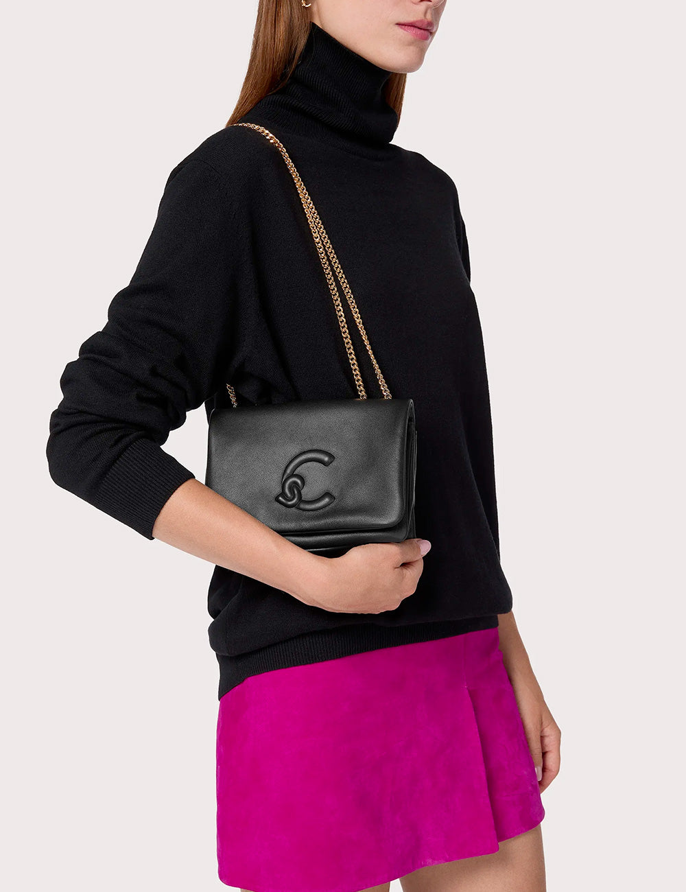 Borsa mini Coccinelle Dulse Noir in pelle nera con catena dorata e logo emboss