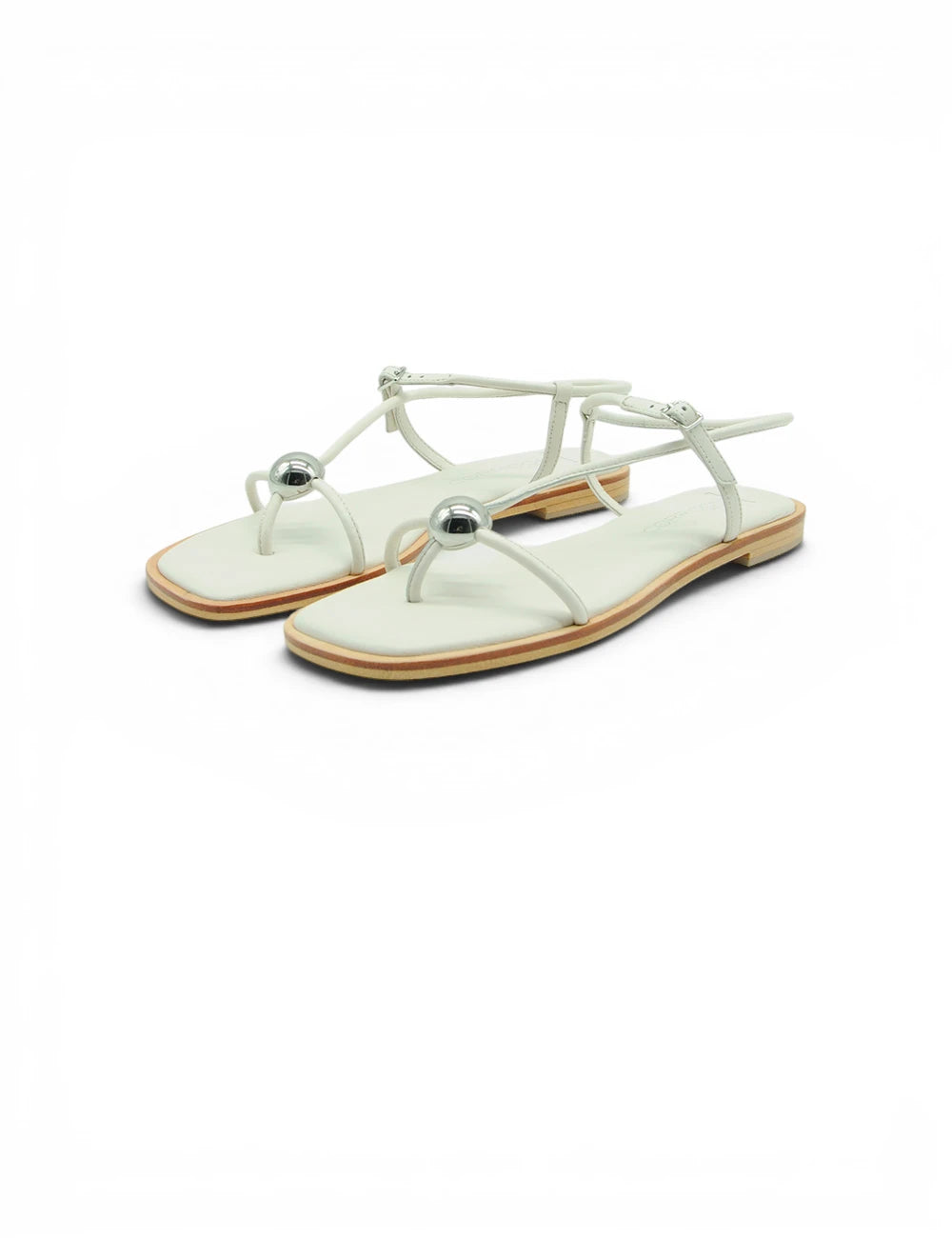 Sandali infradito bianchi in pelle con dettagli sferici argento sulla fascia spazi corridoni 1 sandalo latte