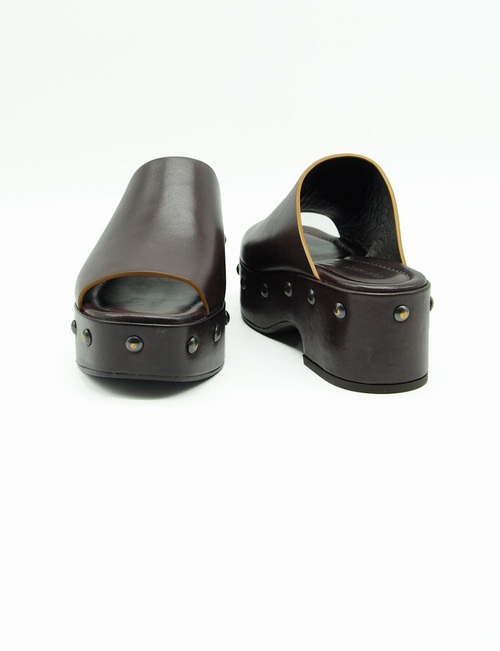 Castagno Zoccolo Curiosité: mules platform in pelle nera con borchie metalliche sulla suola