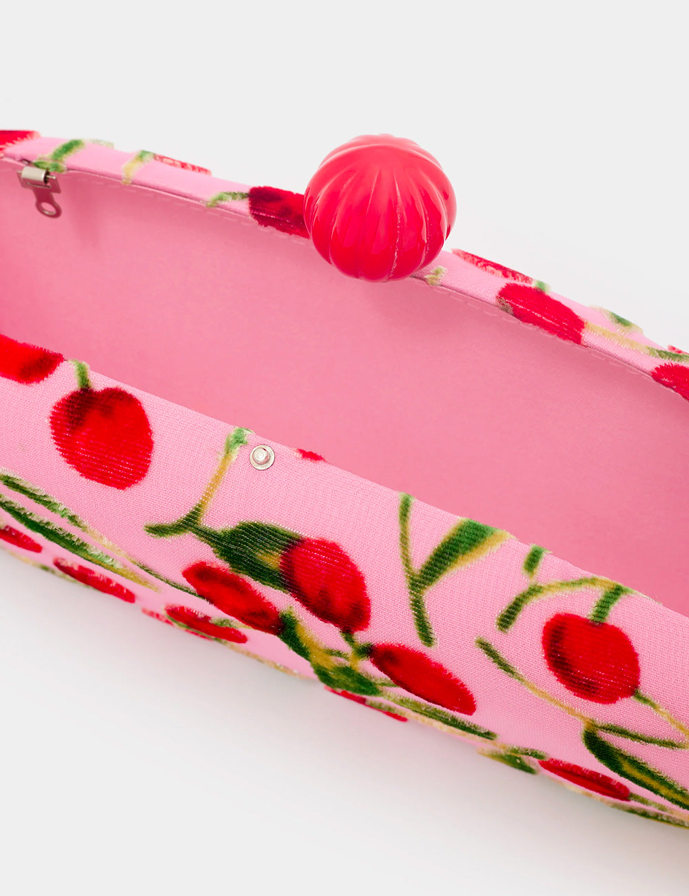 Clutch Nalì Margot Rosa con stampa ciliegie rosa e chiusura sferica rossa lucida