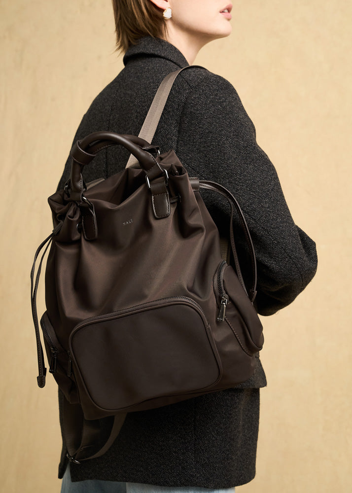 Dark brown nylon backpack with adjustable shoulder straps and front zippered pocket nalì zaino noor marrone