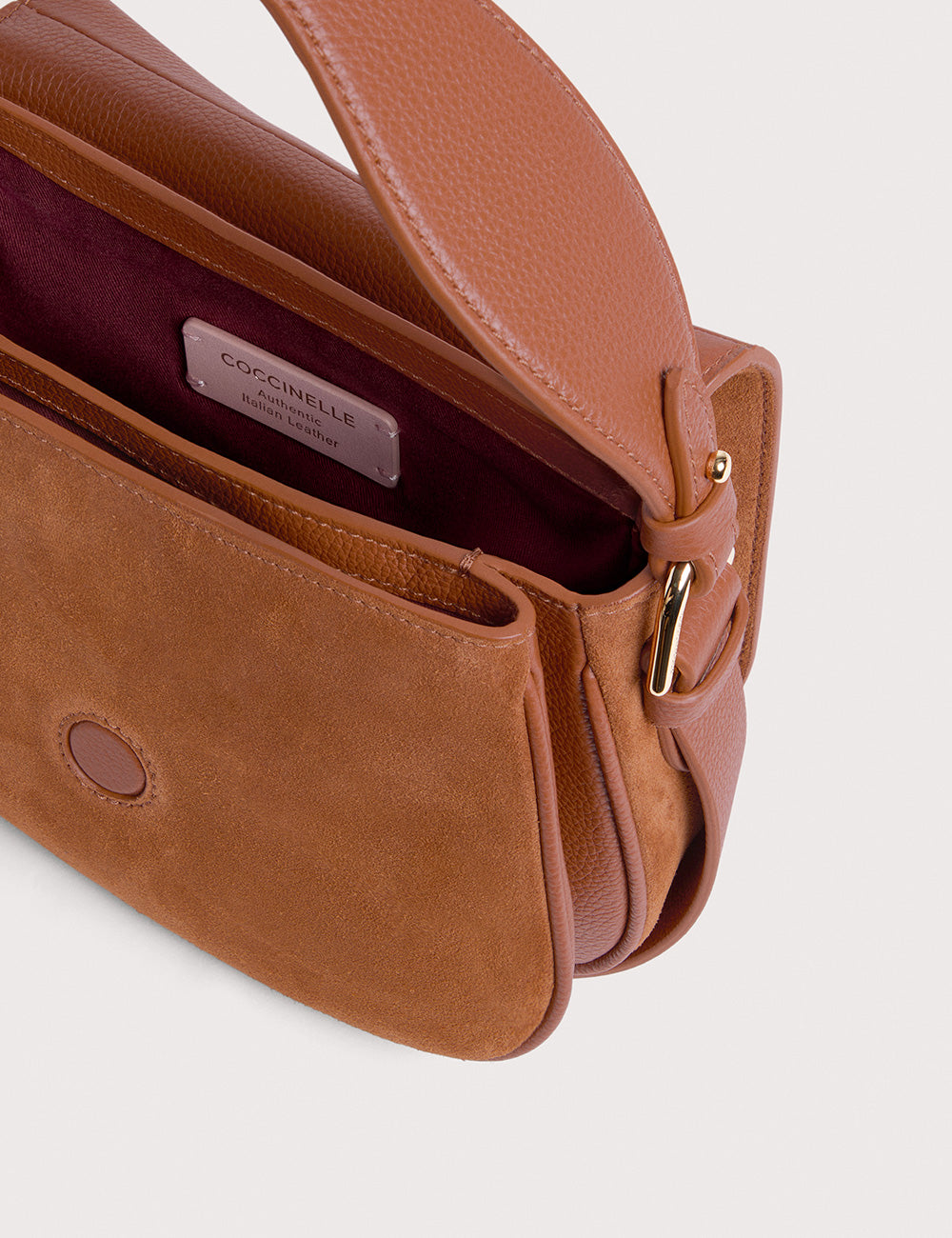 Borsa Coccinelle Mavery Small in suede e pelle cognac con interno borgogna