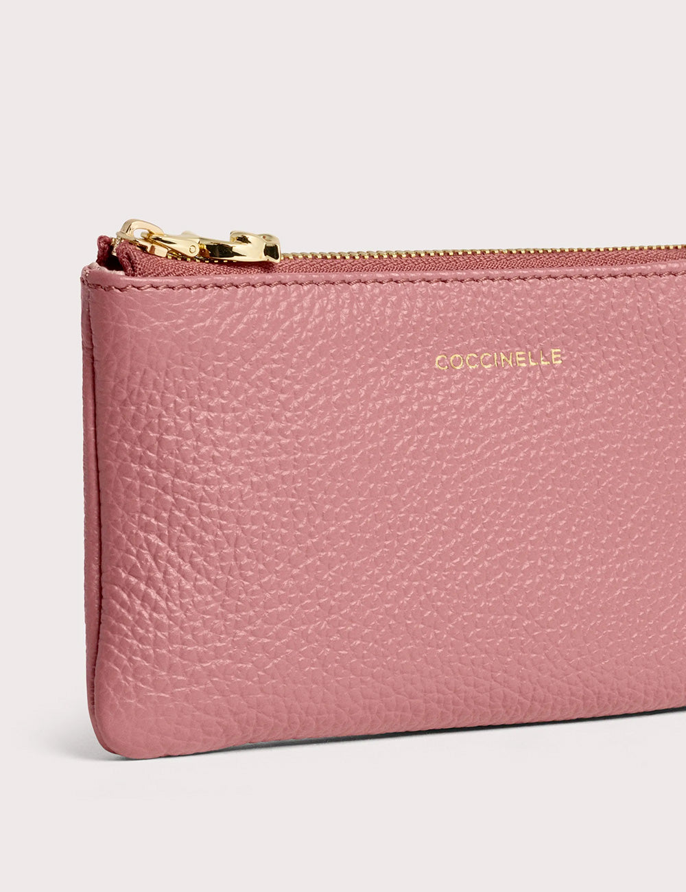 Coccinelle c-me softy small pouch in soft pink textured leather with gold-tone zipper and embossed brand name