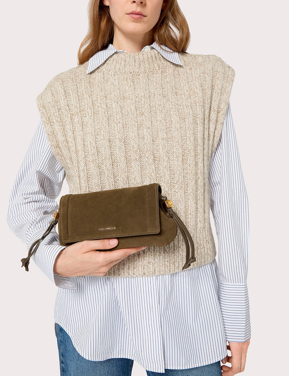 Olive green suede crossbody clutch with gold-tone hardware and drawstring detail from Coccinelle Thess Suede Mini Fango