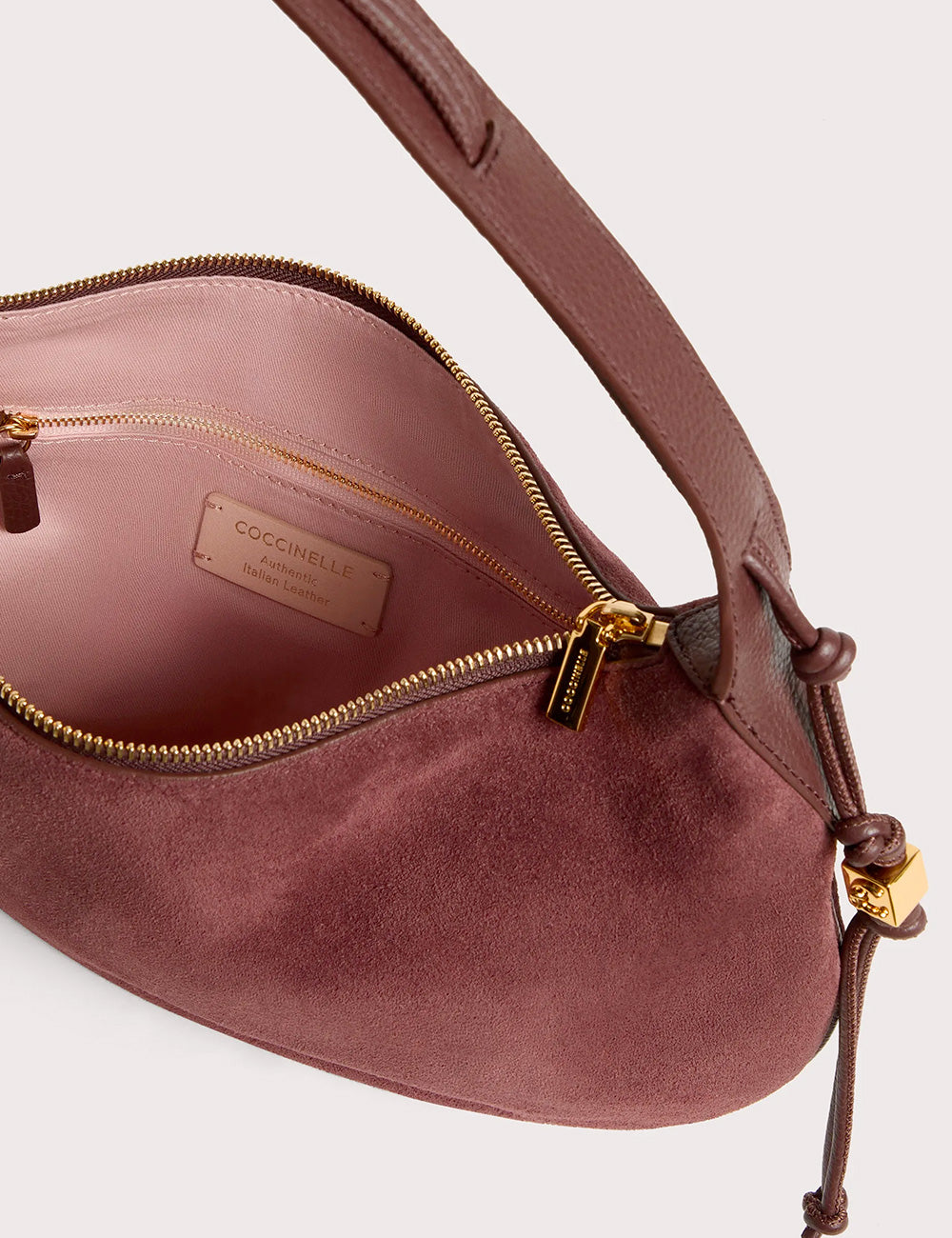 Dusty rose suede handbag coccinelle thess medium berry with gold-tone zippers and braided leather strap