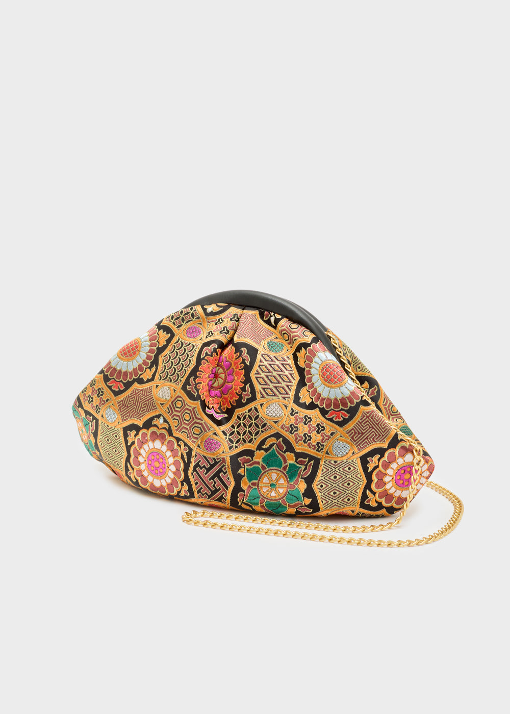 Nalì pochette uranus arancio con motivo floreale e geometrico in rosa verde oro e nero con manico nero e catena oro
