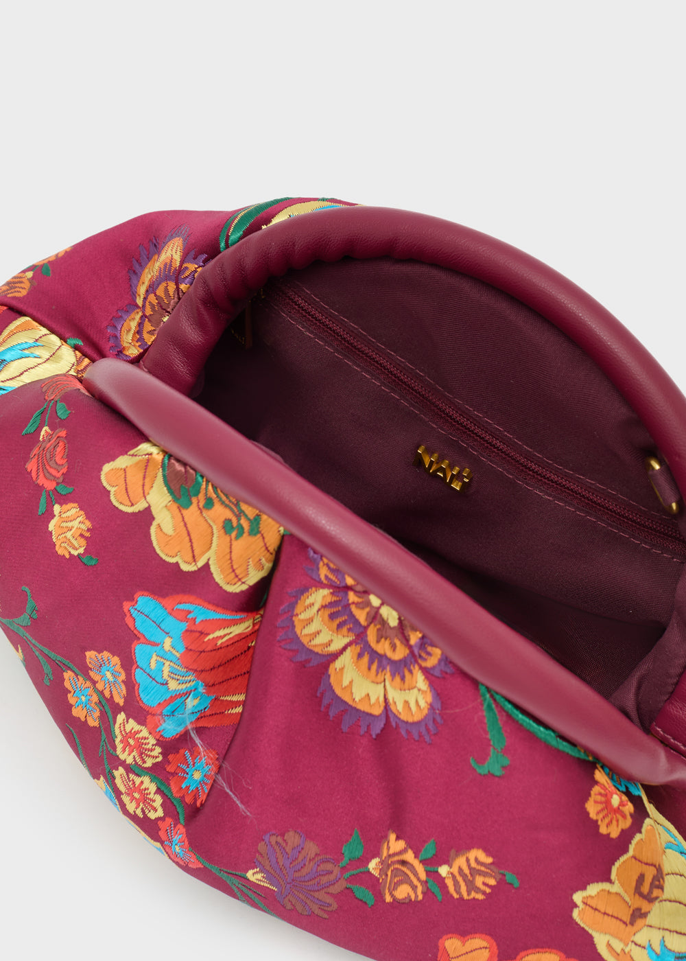 Nalì pochette uranus bordeaux in magenta con motivo floreale colorato arancione blu e verde su clutch elegante